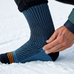 ** Close-up shot of a Merino wool snowboarding sock, showcasing its texture and warmth. Focus on the fibers and construction. safe for work, appropriate content, fully clothed, professional. perfect anatomy, correct proportions, natural pose, well-formed hands, proper finger count, natural body proportions.

2.  **